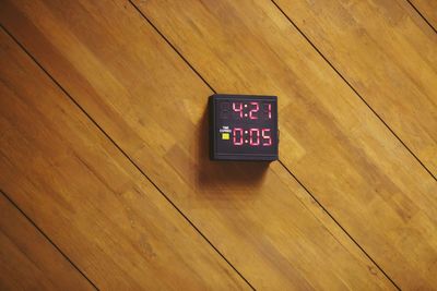 High angle view of clock on table