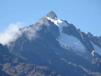 Scenic view of snow covered mountains against sky