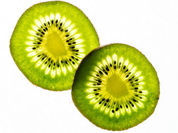 Close-up of lemon slice over white background