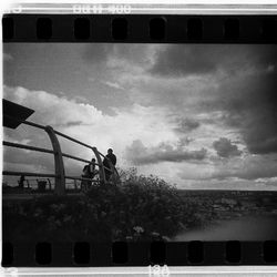 Car on road against cloudy sky