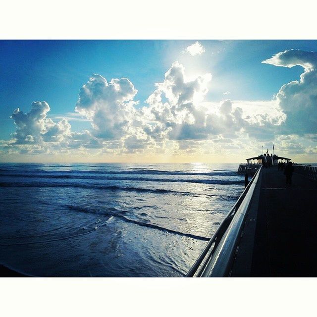 sea, water, transfer print, horizon over water, sky, scenics, auto post production filter, tranquil scene, cloud - sky, tranquility, beauty in nature, beach, nature, cloud, blue, idyllic, cloudy, shore, railing, seascape