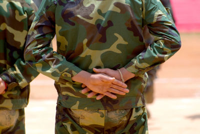 Low section of woman standing in water