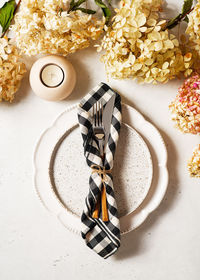 High angle view of white roses on table