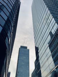 Low angle view of modern buildings against sky