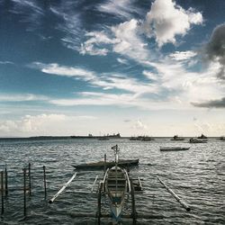 Scenic view of sea against cloudy sky