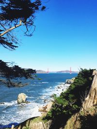 Scenic view of sea against clear blue sky