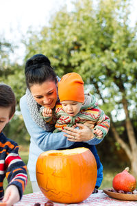 Mother with son and daughter in garden