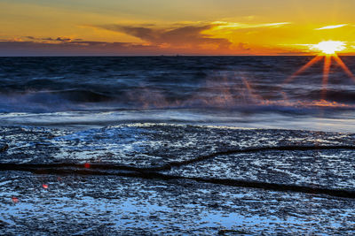 Scenic view of sea against sky during sunset