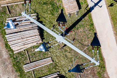 High angle view of birdhouse hanging on field