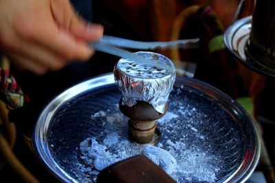 Close-up of person holding wineglass