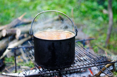 Close-up of food in container on barbecue grill