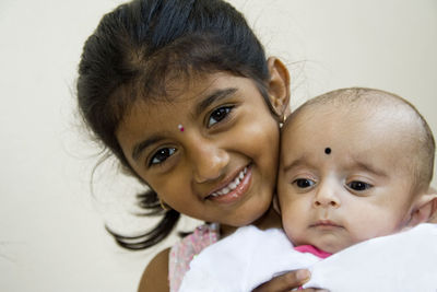 Portrait of mother with baby