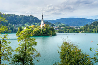 Scenic view of church on island in middle of lake