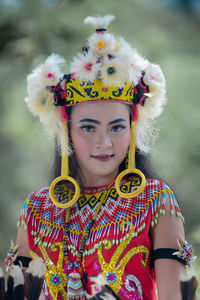 Portrait of smiling young woman in traditional clothing