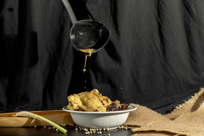 Close-up of opor ayam in bowl on table