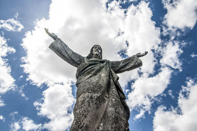 Low angle view of statue against sky