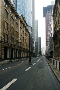 Road along buildings in city