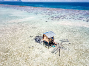 High angle view of small hut on the ocean