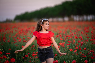 Young woman standing on field