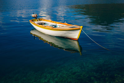 High angle view of boat moored in lake