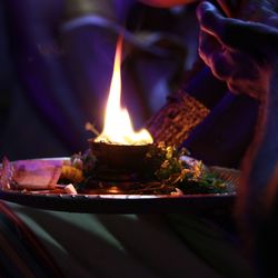 Close-up of diya in puja plate