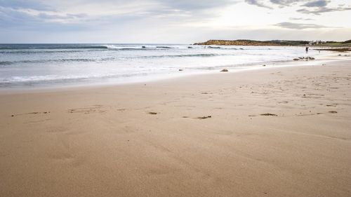 Scenic view of beach against sky