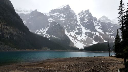 Scenic view of lake and mountains against sky