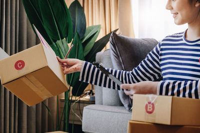 Midsection of woman holding gift box