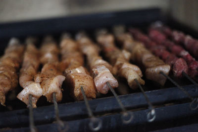 Close-up of meat on barbecue grill