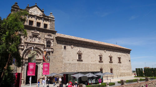 Low angle view of historic building against clear blue sky