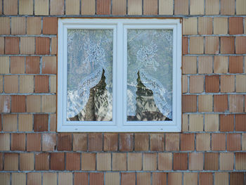 Close-up of window on wall of an unfinished house