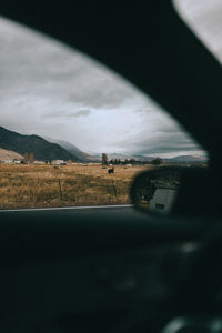 Scenic view of sky seen through car window