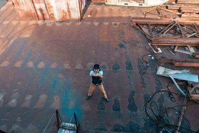 High angle view of man walking by water