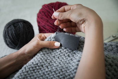 Cropped hand of woman holding hands