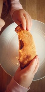 Midsection of person holding ice cream in plate