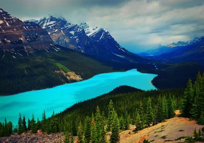 Scenic view of lake and mountains against sky