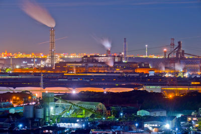 Illuminated buildings in city at night