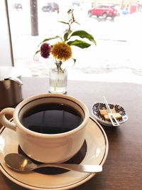 Flower vase on table
