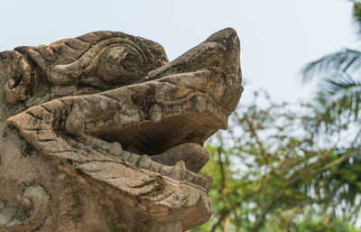 Low angle view of statue against sky