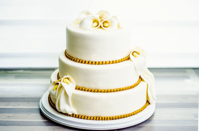 Close-up of wedding cake on table