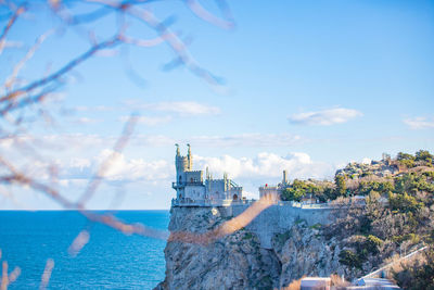 Tower by sea against sky, the swallow nest