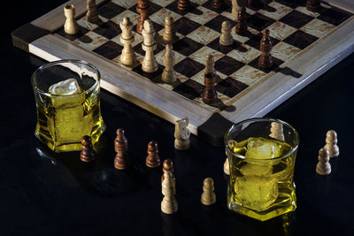 High angle view of chess pieces on table