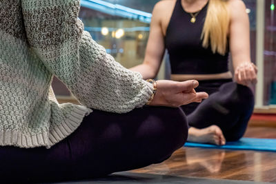 Midsection of woman exercising in gym