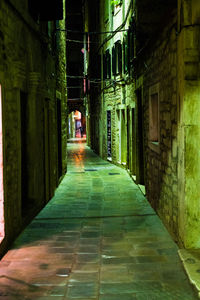 Illuminated alley at night