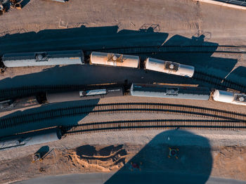 Cargo train waiting to be filled in an oil refineries.