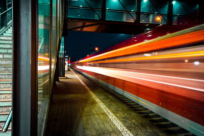 Blurred train under bridge