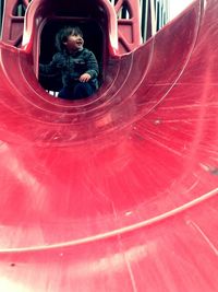 Full length of boy in red umbrella