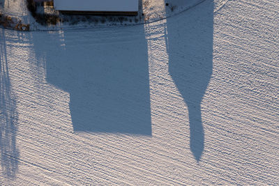 High angle view of shadow on sand