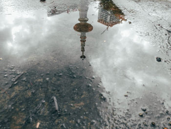 High angle view of puddle on street during rainy season