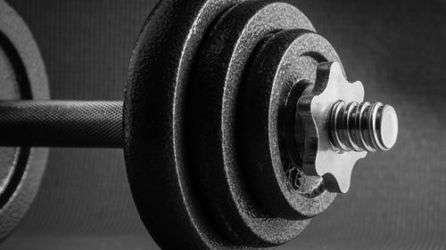 Close-up of dumbbells in gym